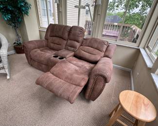 Electronic reclining loveseat with suede leather finish, some areas are worn or could use cleaning, reclining function works well 6ft 8in W x 32in D