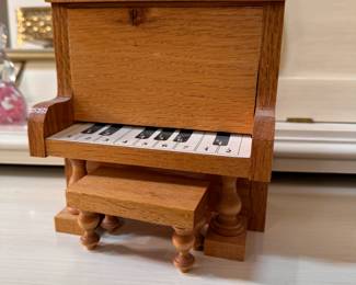 Wooden piano and bench, is a music box (unsure how it plays) 5"H