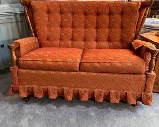 Vintage Broyhill Premier rocking loveseat with tufted back, firm cushions and pleated skirting, some fading to upholstery 48"W x 36"D