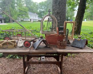 Vintage wagon, picnic basket, tools on display stands, antique roof finials and more