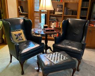 Pair of leather wing chairs and ottoman 