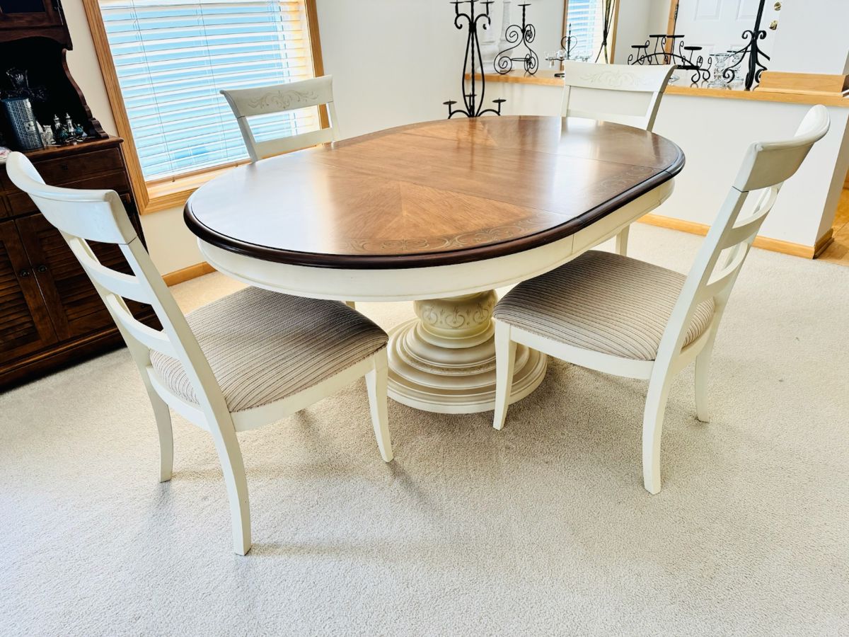 Very nice pedestal base dining table with four chairs.  There is one leaf (as shown), which means this will shrink down to a circle