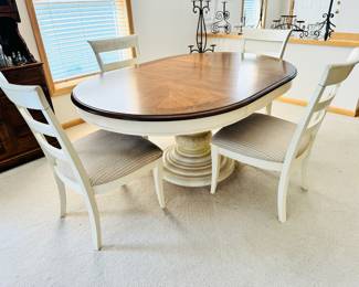 Very nice pedestal base dining table with four chairs.  There is one leaf (as shown), which means this will shrink down to a circle