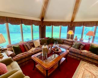 Ethan Allen sectional and Henredon glass top coffee table. Accessories by Nambe and Pottery Barn