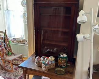 Antique display cabinet 
Eggs
Antique table 