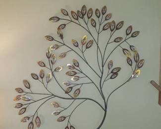 Wall decor. Metal leaves. Approximately 30 x 35. Located in basement