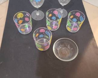 Plastic drinking glasses and a small glass bowl.