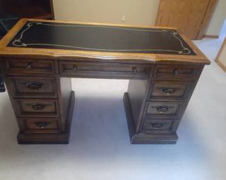 Wooden desk with 7 drawers. 30 x 48 x 22. Located in basement