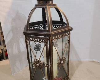 Candle lantern about 22 in. tall. Missing one glass pane.