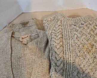 Two mens XXL sweaters. The Woolrich on left needs cleaned, dirt on cuff.