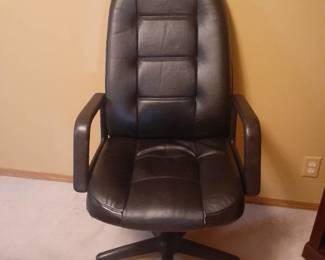 Leather office chair. See pictures for details. Located in basement