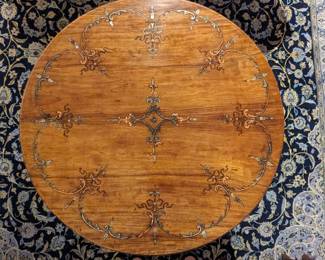 Top detail of the fruitwood inlaid drum table.