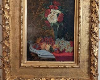 One of the pair of antique, artist-signed fruit still life pieces.