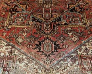 GORGEOUS Persian Heriz hand-woven rug, measuring 12' x 8' 6", atop a sisal rug that measures 14' 10" x 10' 3".