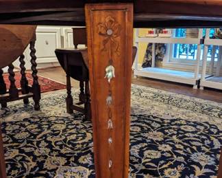 Cascading bellflower MOP inlay detail on each of the legs.