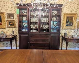 1930's mahogany breakfront, with mullioned glass doors, pair of antique English mahogany console tables, w/two drawers and pencil inlay, three pair of very good original oils on canvas, assorted sterling and silver plated items.