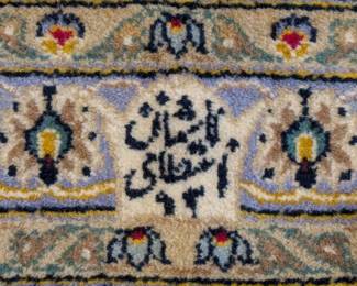 Weaver's signature in the Persian Kashan rug. 