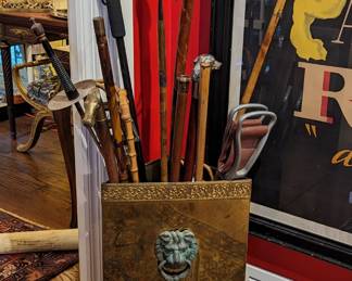 Vintage English brass corner walking cane stand, with, you guessed it, walking canes!