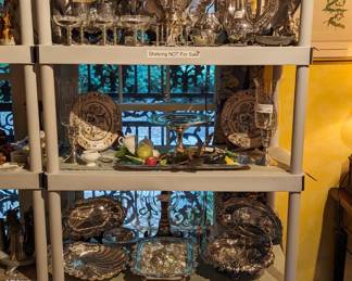 Motley silver plated holloware and serving pieces, with a few sterling silver items liberally sprinkled about. 