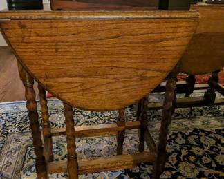 Another of the English barley twist drop-leaf side tables, with one of many English wooden boxes. 