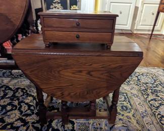 The smallest of the three English barley twist drop-leaf side tables, with another of the wooden English boxes. 