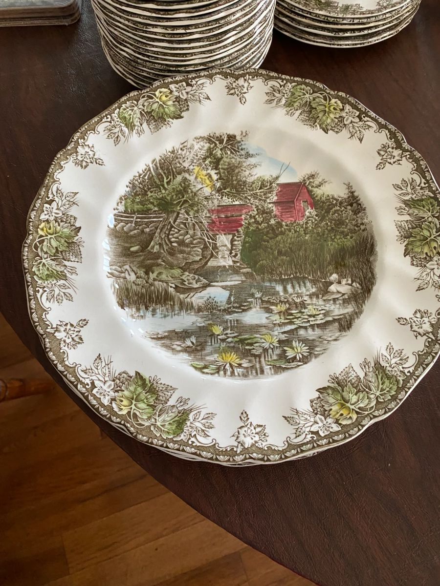 The Friendly Village by Johnson Bros.  Made in England.  Includes 4 dinner plates, 1 lunch plate, 5 pie plates, 17 saucers, 4 fruit dishes, 6 small pie plates, 16 coffee cups, 6 mugs.