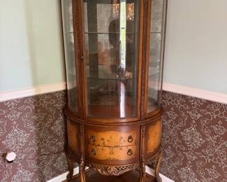 French-influenced antique Victorian curio cabinet. Lighting has been added at the top. The curved glass is perfect, with no cuts or scratches.