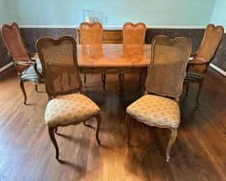 Drexel dining table and chairs. The table shows one leaf; a second leaf is part of the table. A protective cover for the table top is available, if desired. Coordinating chairs (sold separately) are available too.