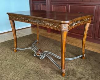 Desk with decorative wrought iron attachments