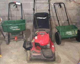 Lot 129-G: Lawncare Trio

Includes: 
•	Troy Bilt Self Propelled Gas Lawn Mower w/ 21” cutting deck
•	Mower has Briggs & Straton 190cc engine.
•	Features side and rear-discharge options
•	Grass-collector included
•	Scotts Spreaders AccuGreen 1000 and Speedy Green 3000 (orange-accented)
•	See pictures for more details

Dimensions: Spreader bin sizes:
•	1000: 19”W x 7.5”H (front)
•	3000: 20.5”W x 10”H

Condition: See photos for spreader handle wear. Mower is good but used. Its rubber height adjuster cover (front right, as you’re standing behind the mower) is missing. Working function is unknown; we hope to attempt to start it and test it soon.
