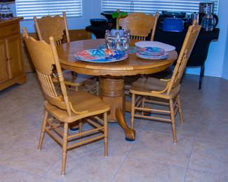 Intricate wooden dining table with leaf and chairs(x4)