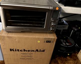 one used Breville countertop oven and a brand new, still in box kitchenaid countertop oven