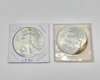 #1300 • (2) 1986 American Silver Eagle Dollar & 1922 Liberty Silver Peace Dollar
