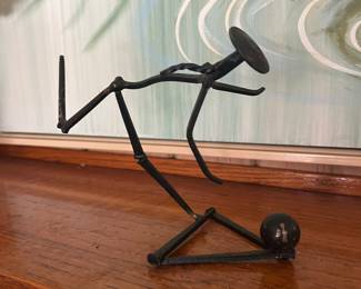 metal bowler sculpture