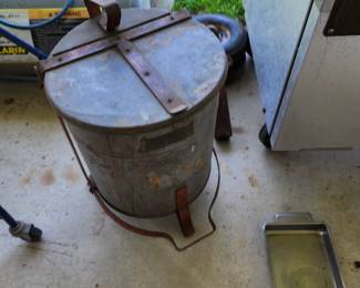Vintage trash can - cover lifts when you step on the bottom lever. Used for storing oily rags in a garage
