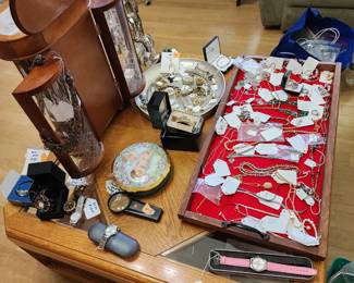 Drawers of jewelry box filled with earrings