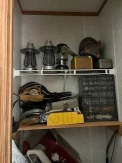 Lanterns and screws cabinet, extension cords other guy stuff