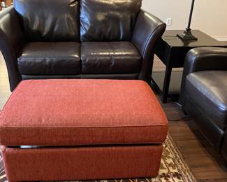All leather loveseat and occasional tables.