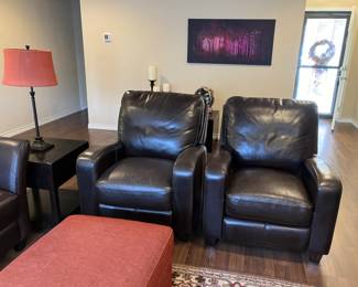 Two all leather recliners.  Orange ottoman opens for storage. 