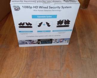 Specialty hard wired camera security system. Unopened, new in box.