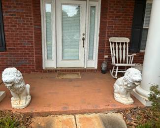Large, heavy concrete statues, wooden rocking chair