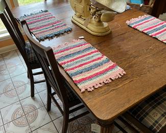 Vintage oak table and upholstered straight chairs