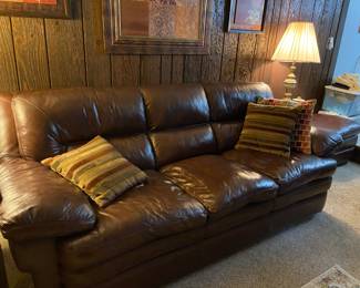 This leather couch has a matching chair and ottoman…..come check it out.