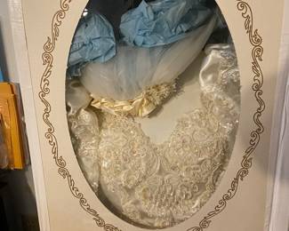 This is a great wedding dress that has been boxed and preserved for years. Come check it out and see the original photo from when the dress was worn.
