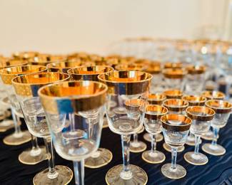 Gold rimmed glasses and barware 
