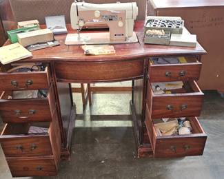 DESK WITH SEWING MACHINE AND SEWING ITEMS
