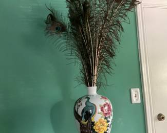 Peacock vase with peacock feathers