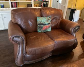Distressed, leather loveseat