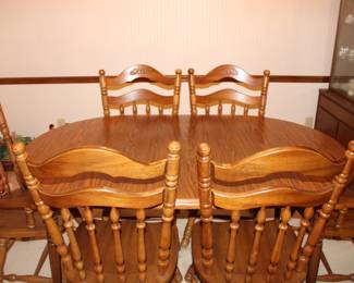 Dining room table with two leaves and six chairs. Pictured with one leaf inserted. Heavy!