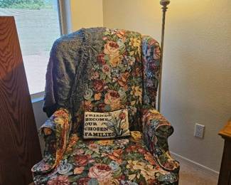 Floral Sitting Chair And A Floor Lamp
